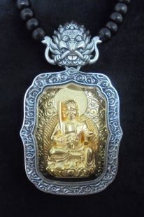 Silver frame w/brass deity